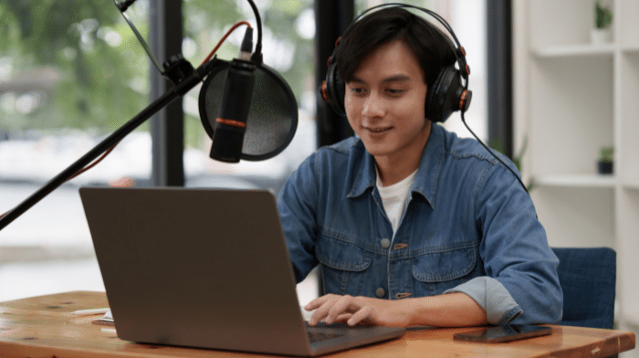 Podcaster with laptop